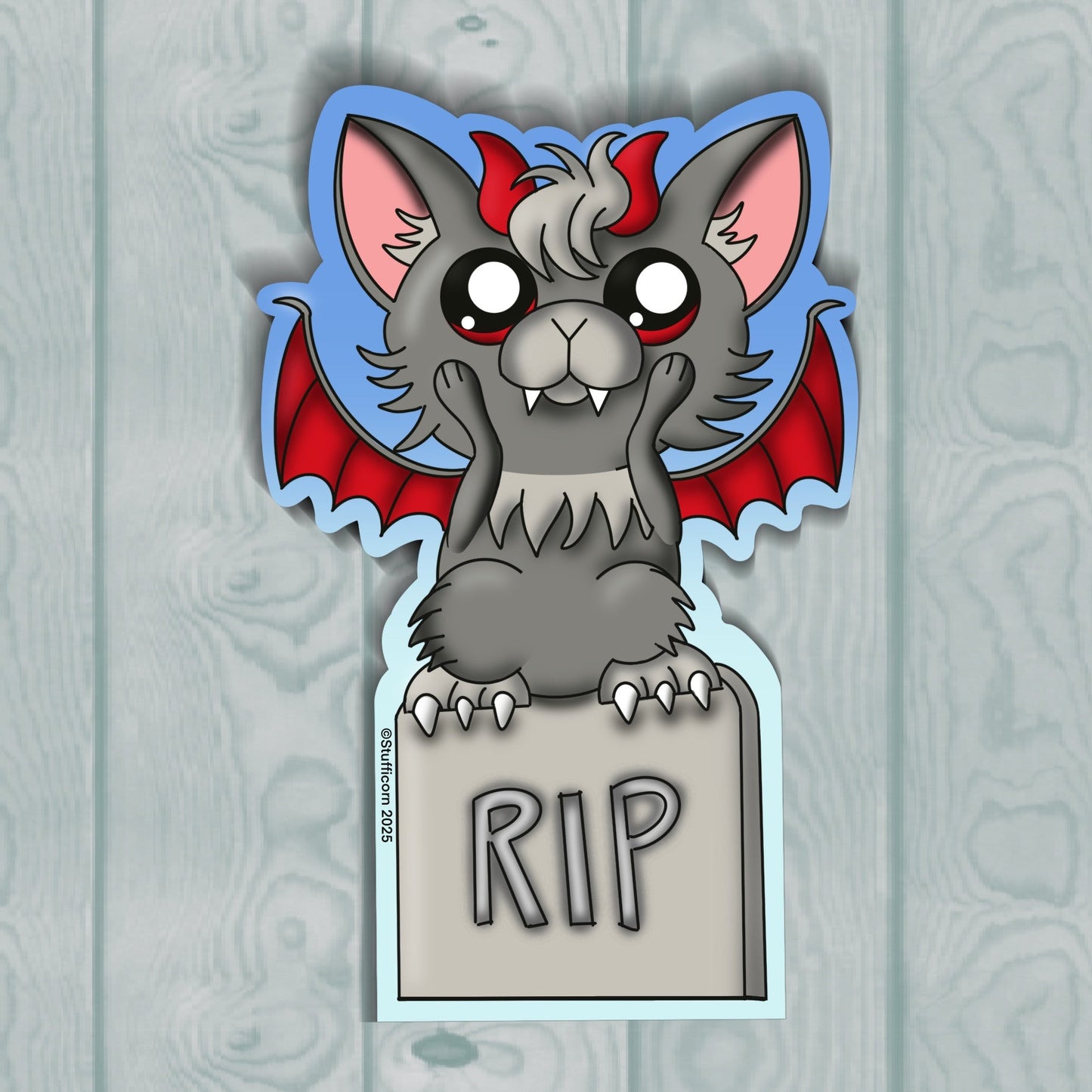 Cartoon gargoyle with red wings and 'RIP' sign on a wooden background