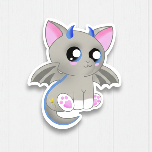 Sticker of a cute grey cat with dragon features, such as wings and a tail, with a glossy finish on a white background.