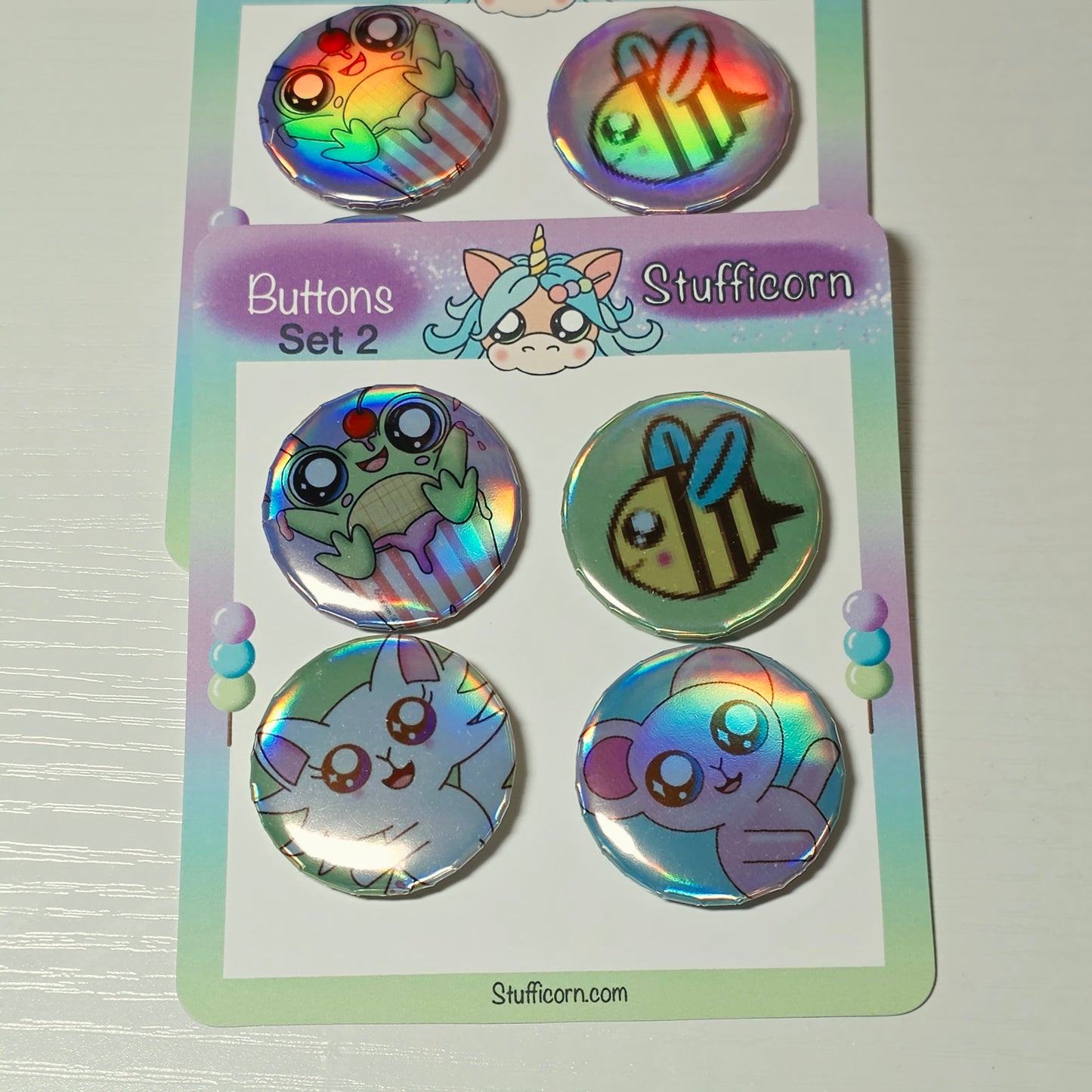 Set of colorful buttons on a Stufficorn branded card