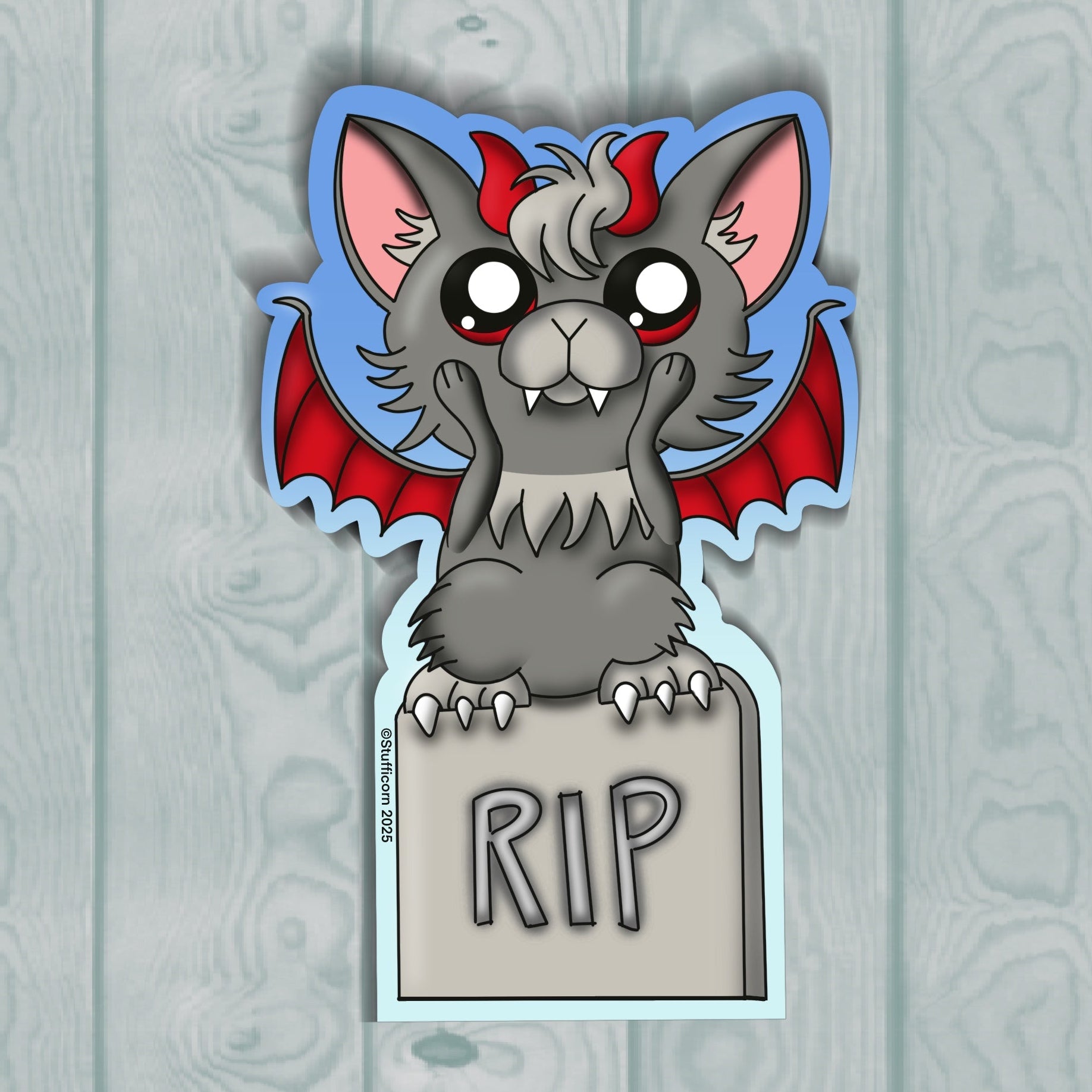 Cartoon gargoyle with red wings and 'RIP' sign on a wooden background