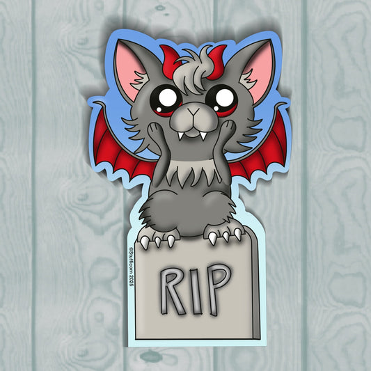 Cartoon gargoyle with red wings and 'RIP' sign on a wooden background