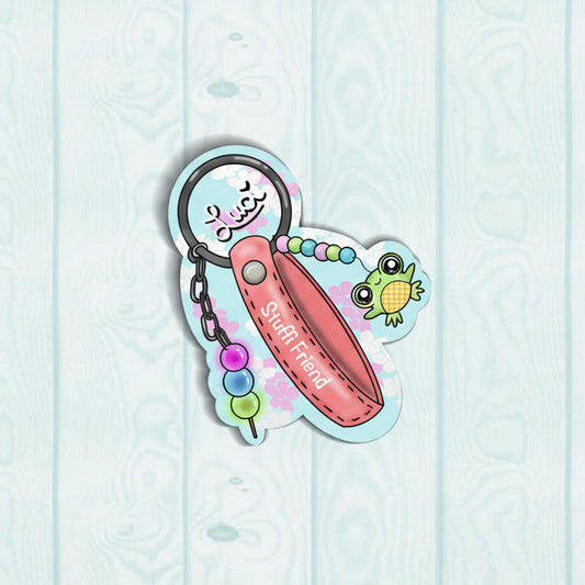 small green frog charm hanging on a pink bracelet keychain